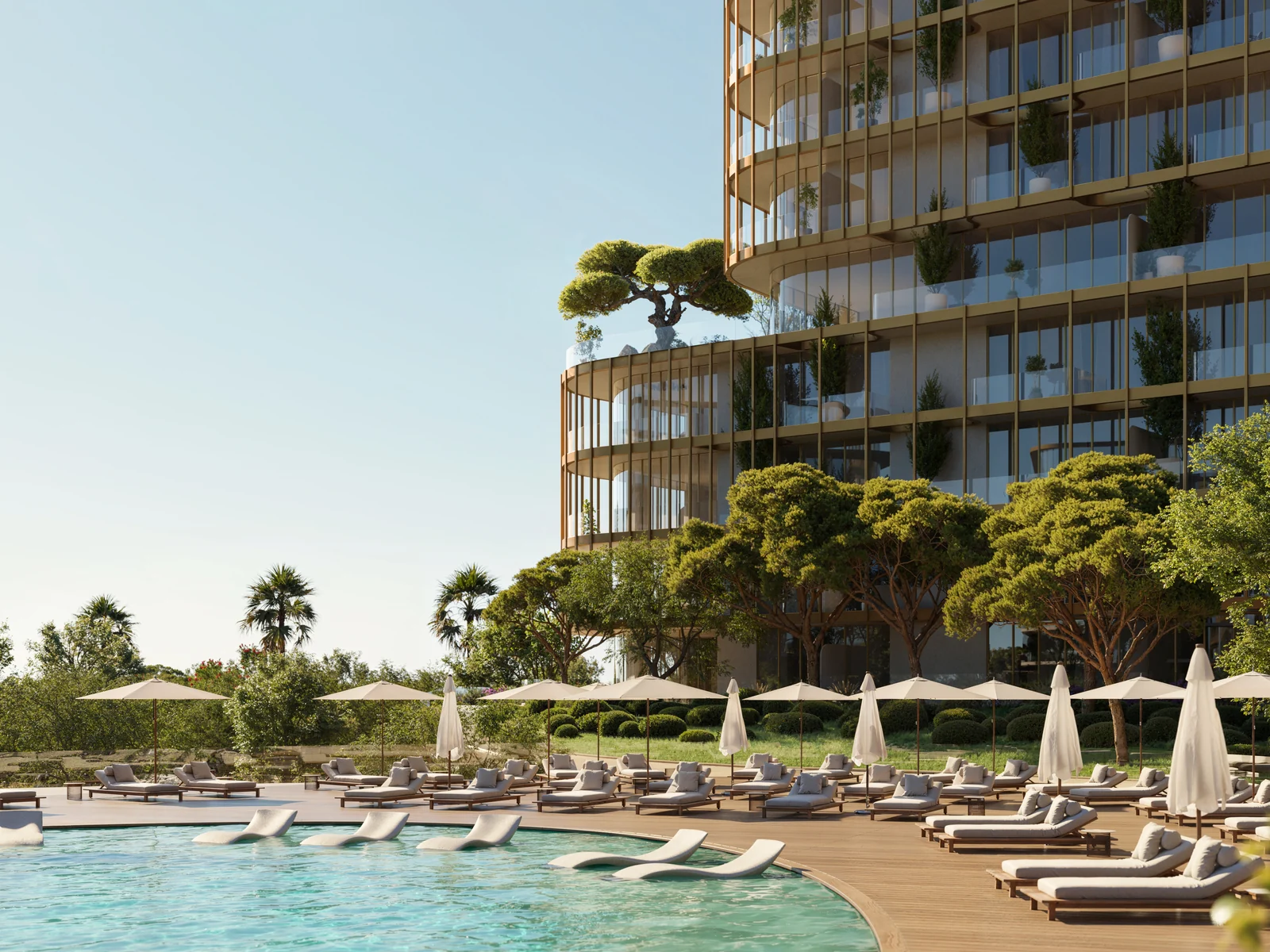 Hado, pool deck with loungers and views of beach and sea