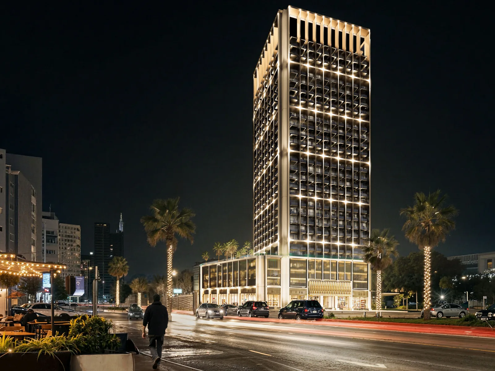 Binghatti Luxuria, beleuchteter Turm bei Nacht
