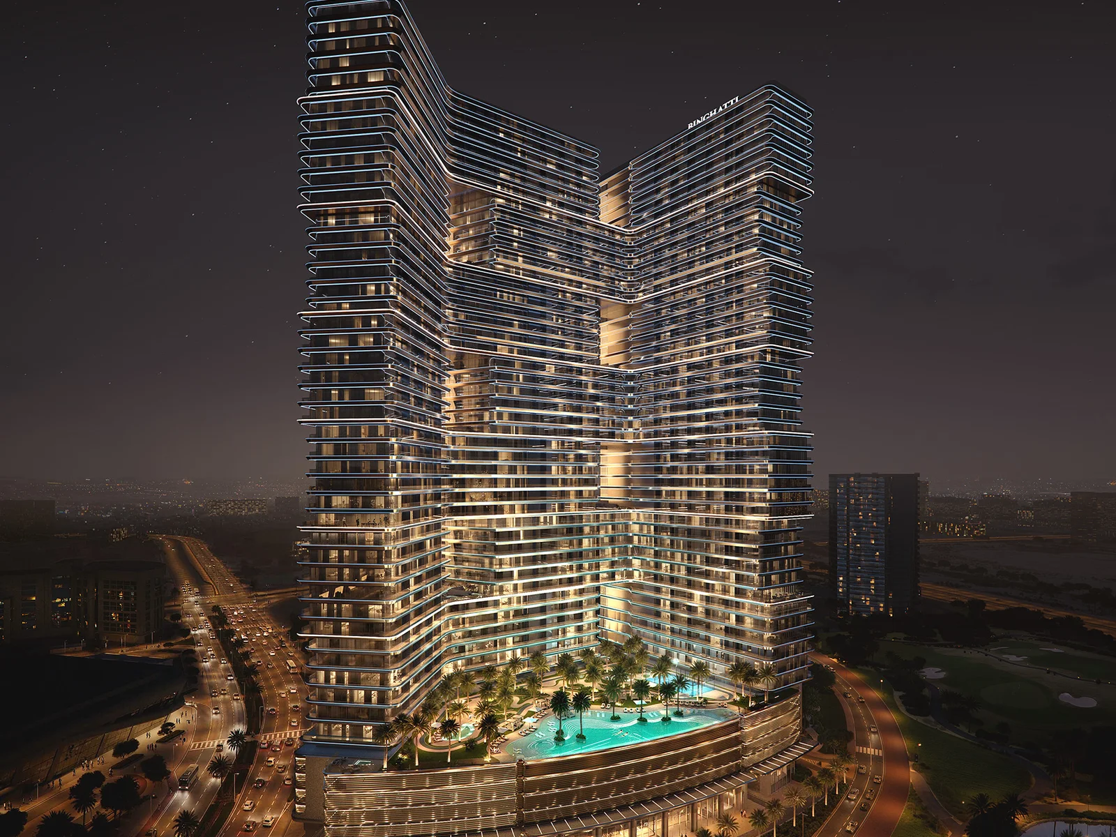 Binghatti Skyterraces, beleuchteter Turm bei Nacht